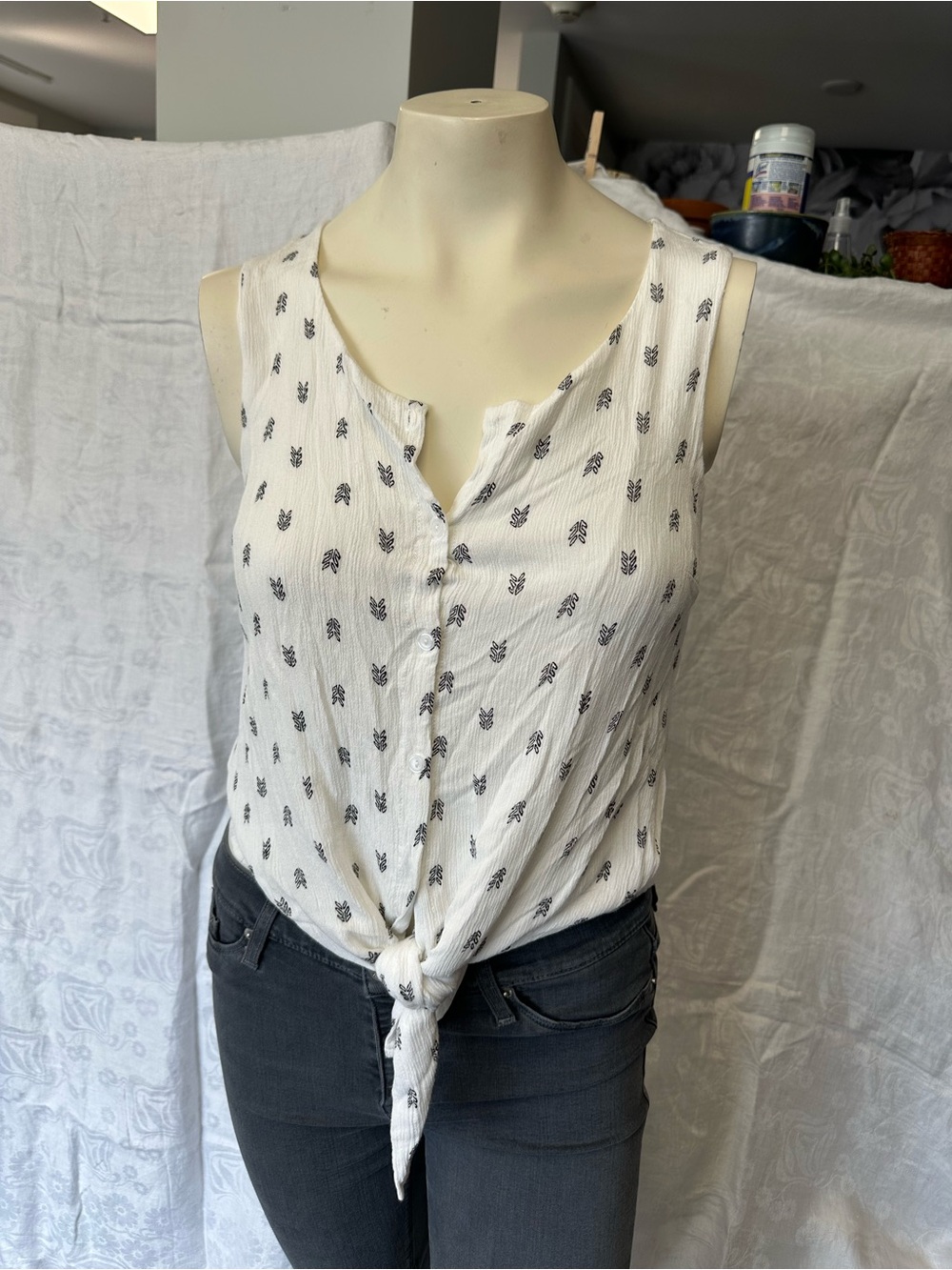 White Sleeveless Button Tie-Front Tank with Black Motif